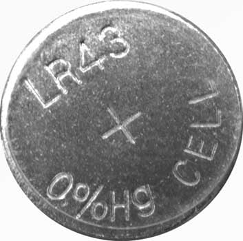 Photo of a 1.55 volt LR43/186 alkaline button cell battery.