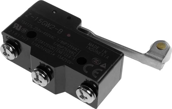 Photo of a Z15GW22B high voltage micro switch with a long roller and small wheel actuator.