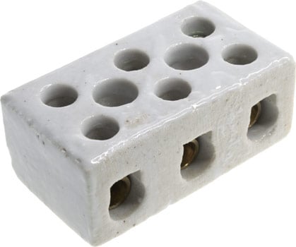 Photo of the top of a 3 way 30a porcelain terminal block.