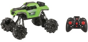Photo of a green 1:16 remote controlled rock crawler with sideways drift.