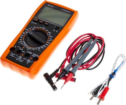 Photo of a digital LCD multimeter/voltmeter/ammeter that measures/tests AC DC OHM volt current, plus the included cables.